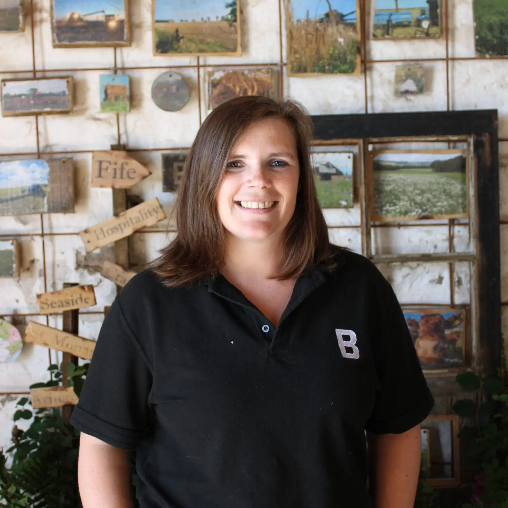 Kylie Clark, Bowhouse team Kylie Clark of the Bowhouse team, smiling in front of a shop display