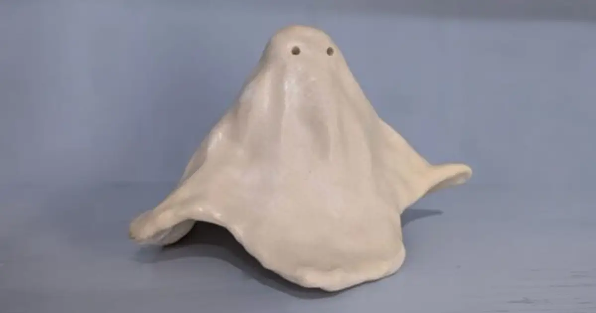 Small handmade ceramic ghost with two eye holes
