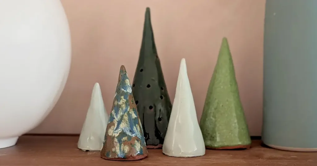 Handmade clay Christmas tree ornaments in green and white glazes